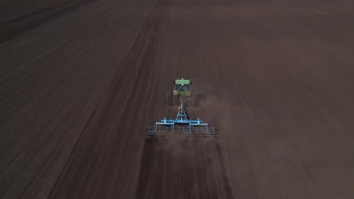 Agricultural Machinery in the Field for Sowing Crops Aerial Shot