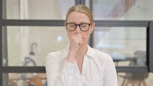 Portrait of Coughing Sick Mature Business Woman in Office