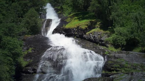 One of the many beautiful waterfalls in the Geiranger fjord. A powerful stream of white-water cascad