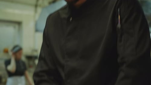 Chef Slicing Red Onion in Restaurant Kitchen