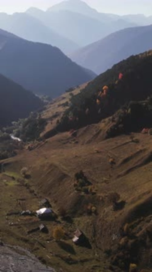 Lush Forest and Cliffs in a Morning Fog Action Aerial View of a Beautiful Stream Flowing on Mountain