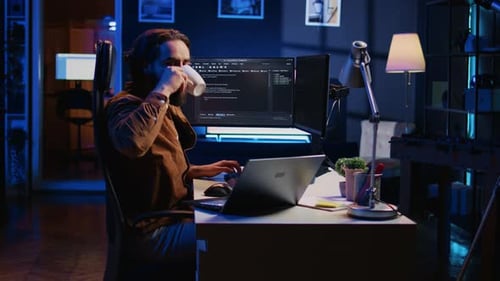 IT Expert Doing Multitasking in Home Office Listening Music Drinking Coffee