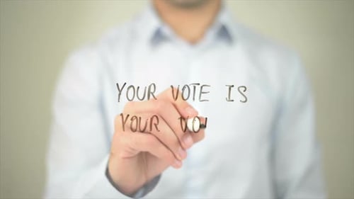 Your Vote is Your Voice, Man Writing on Transparent Screen