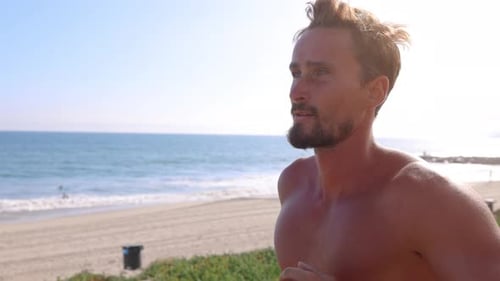 Athletic Man Exercising At The Beach