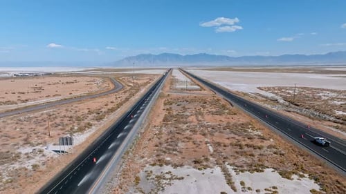 Highway Through the Desert Sands and Salt Flats of the Blue Sky