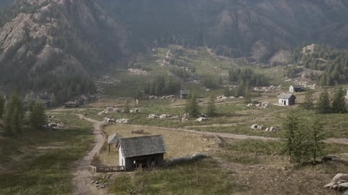 Flying Aerial View Over a Rustic Mountain Village Landscape