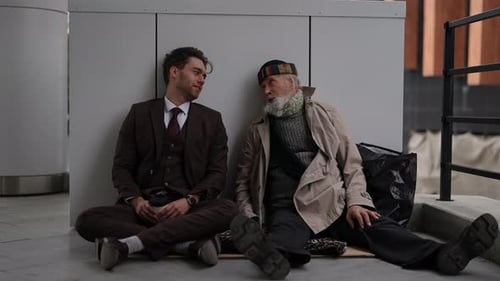 Young Adult Talking with Senior Outdoors