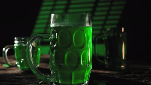 Green Glass on Wooden Table for Saint Patrick Day