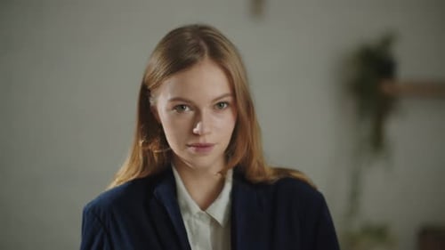 Woman Smiling Confidently in Business Attire