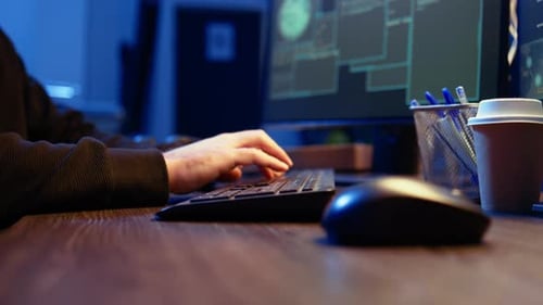 Meticulous Hacker Typing on Computer Keyboard Close Up