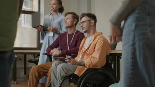 Diverse Group Attending Meeting in Modern Office