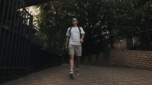 Man Walking Down City Street