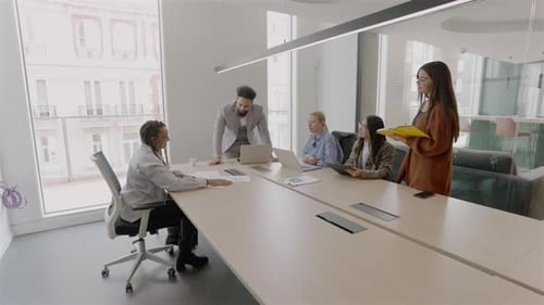 A Diverse Team Working Together in a Modern Innovative Office Environment to Achieve Goals