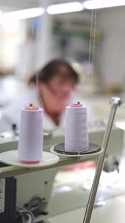 Textile Factory Sewing Machine Operations with Thread Spools