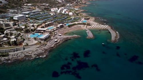 Modern all inclusive holiday resorts in Chersonissos at the Greek island Crete. Drone panning shot