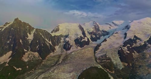 Drone Flies Over Green Picturesque Valley with Mountains in the Background High Mountains Famous