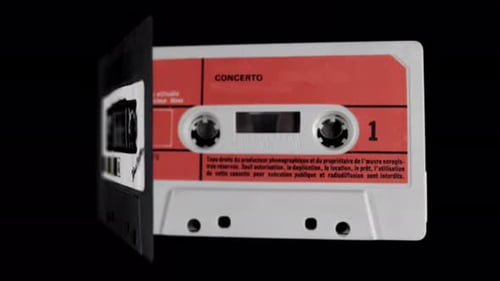 Collection of Audio Cassettes on Black Background