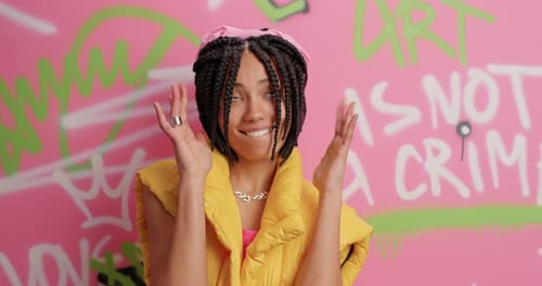 Trendy Street Artist Makes Cool Gesture Dressed in Yellow Vest Enjoys Spare