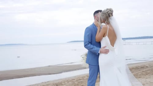 Stylish Couple Embrace on Beach Wedding Day