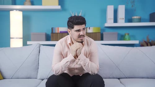 Worried and unhappy young man.
