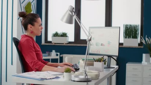 Woman Working at Desk in Home Office