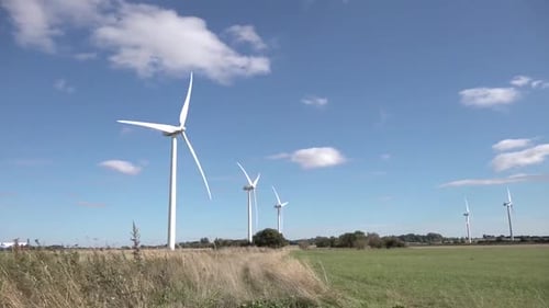 Wind turbines turning in strong winds.