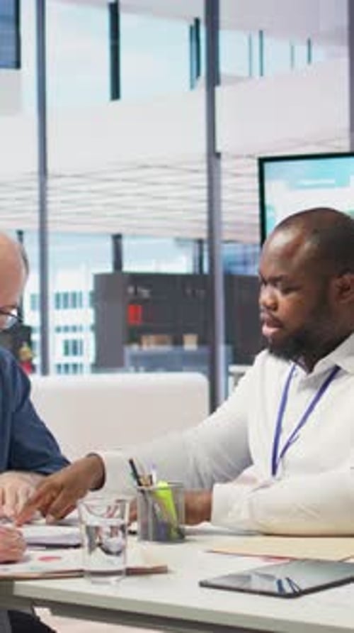 Advisor Discussing Documents with a Mature Couple