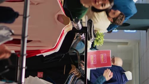 Customers Shopping on Black Friday at Clothing Store