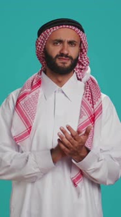 Vertical Video Adult in Traditional Attire Clapping
