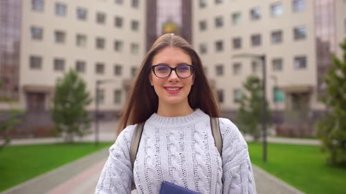 Woman Student Outdoors Smiling Education on Background of Campus University