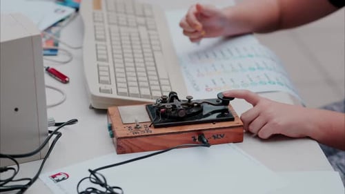 Child Learning Morse Code on Vintage Equipment