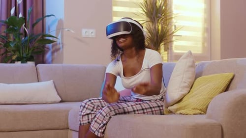 Woman Enjoys Virtual Reality Experience at Home