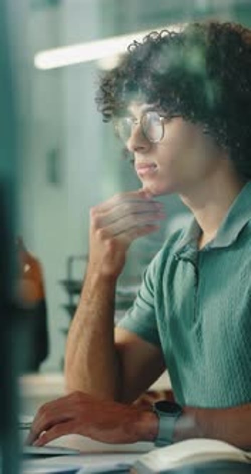 Man, thinking and programming with computer in office, online and planning for software development