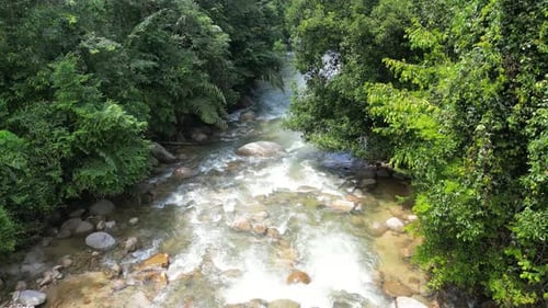 A soothing cascade of water and rock in a picturesque riverside
