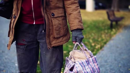 Homeless Man Walking in Park Sad Portrait