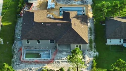 Aerial View of Residential Private Home Under Construction and Yard Ground Works with Swimming Pool