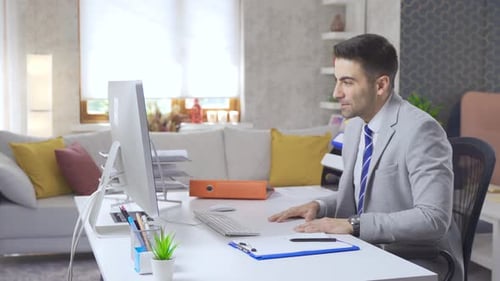 Businessman online video conference working in his home office.