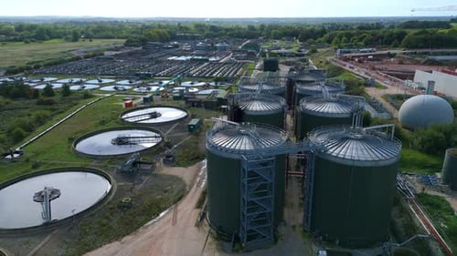 Aerial view of water treatment plant tanks, United Kingdom.