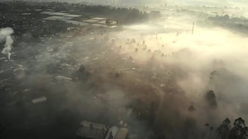 Aerial view of beautiful foggy mountain valley in the morning