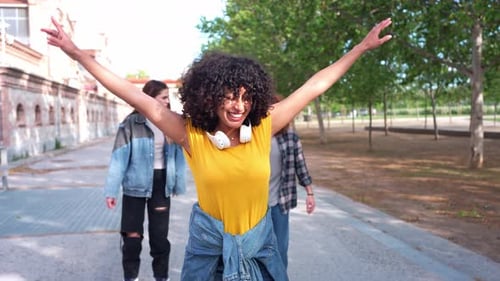 Happy Young Adults Exploring City Park on Sunny Day