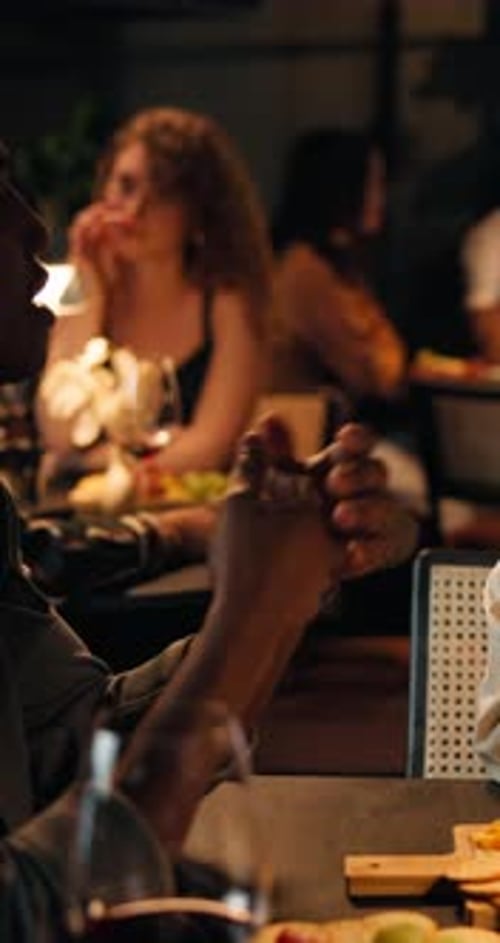 Night, couple and happy with talking in restaurant for first date, connection