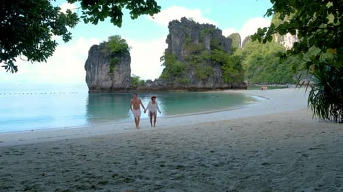 Couple Men and Women on a Tropical White Beach in Thailand Koh Hong Island Krabi