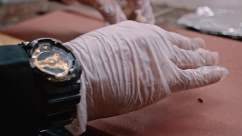 Preparing pastrami sandwich, meat and bread, close up