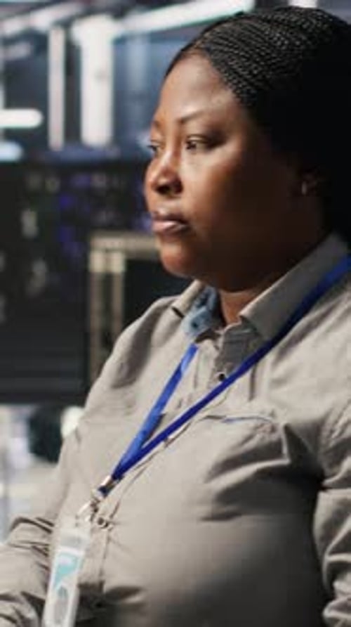 Vertical Video Data Center Programmer Coding on PC Doing Software Updates for AI Systems