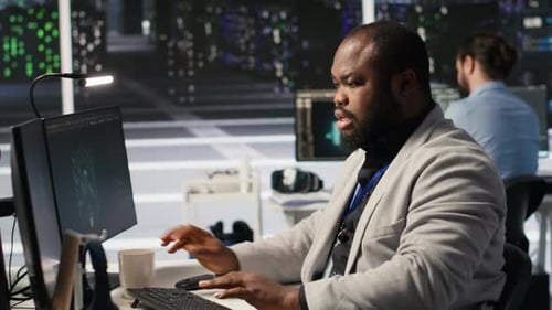 Stressed Technician in Data Center Managing AI Servers Drinking Coffee