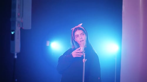 Female Reggaeton Singer Performing Music in Studio