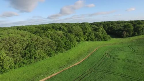 Breathtaking Green Mountain Plateau and Rugged Alpine Peaks Under Clouds