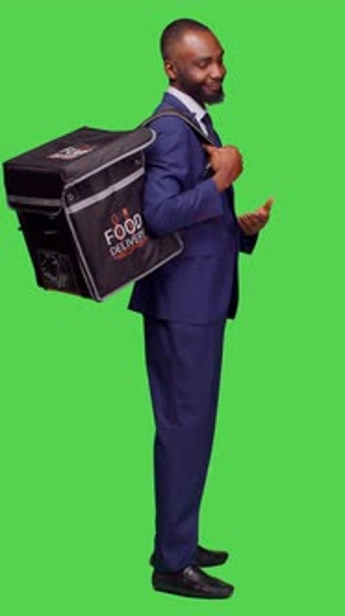 Vertical Video Profile of Young Deliveryman in Suit Giving Fast Food Order