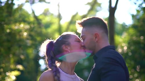 Happy couple kissing in the park