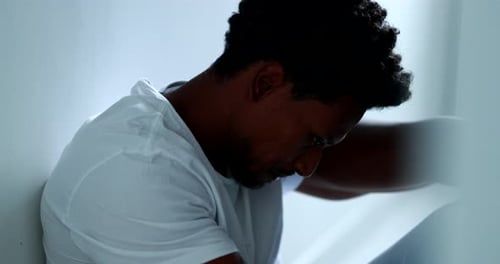 Black man thinking about problems, feeling stressed